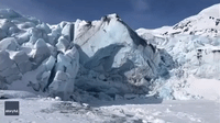 Giant Block of Ice Cracks and Collapses in Front of Hikers at Portage Glacier, Alaska