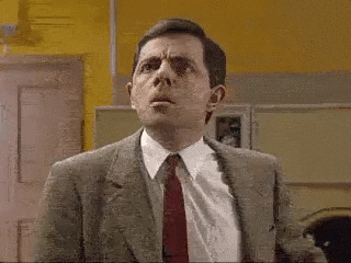 TV gif. Rowan Atkinson as Mr. Bean looks up, flares his nostrils, and contorts his facial expression into one of confused incredulity before throwing up his hand in disgust and vigorously nodding his head. 