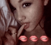 Biting Ariana Grande GIF