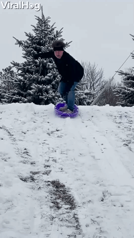Manâs Sledding Stunt Ends in a Snowy Roll