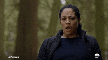 TV gif. Riann Steele as Finola on Debris breathes deeply and frowns, appearing shocked .