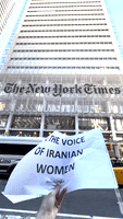 Protester Shaves Head Outside New York Times Office in Call for More Coverage of Iran Unrest