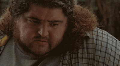 TV gif. Closeup of Jorge Garcia as Hurley on Lost staring at the ground, pensive, then saying "What."