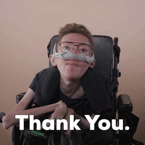 Reaction gif. A mobility-impaired white man using a power chair, a ventilator, and wearing retro-crossbar glasses says decisively, "Thank you."