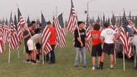 High School Football Team Helps Plant Flags for 9/11 Memorial Display in Idaho
