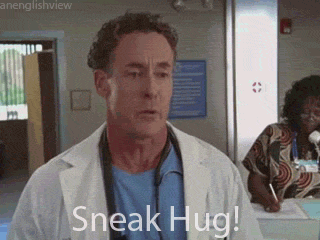 TV gif. Zach Braff as J.D. and John C. McGinley as Perry. J.D. runs and embraces Perry cheekily as he says, 