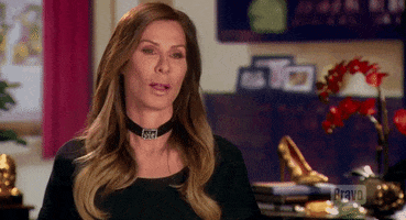Reality TV gif. Carole Radziwill talking head from Real Housewives of New York, sticking her tongue out and blowing a raspberry.