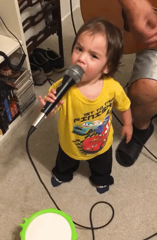 Toddler Sings Along as Grandad Plays Guitar