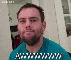 Video gif. A bearded young man tilts his head back in a sappy, over-the-top reaction to something sweet. Text: A drawn-out "Aww!"