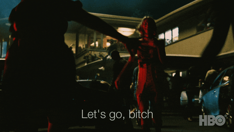 TV gif. Hunter Schafer as Jules from Euphoria stylishly wears a mini dress as she leads Maddy and Kat towards a hype, crowded house party at night. Text reads, "Let's go, bitch."