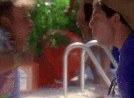 SNL gif. Adam Sandler and Chris Farley lean excitedly face to face with open mouths and thumbs up. 