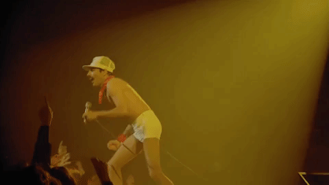 performing freddie mercury GIF