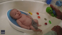 Baby Has Cute Reaction to Water Toy