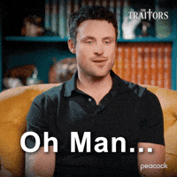 Sponsored gif. Traitors cast member Dylan Efron looks off to the side with an embarrassed expression before covering his face with both hands. Text reads, “Oh man…”