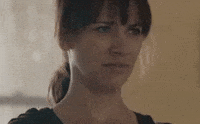TV gif. Rashida Jones reacts with disgust as if she's saying "blah."