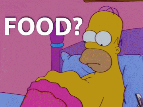 The Simpsons gif. Homer lays in bed without a shirt on. He looks down at his stomach which is grumbling in hunger, basically rippling like waves. Text, “Food?”