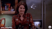 megan mullally eyebrow raise GIF by Will & Grace