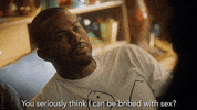 TV gif. Trevor Jackson as Aaron in Grown-ish. He's laying on a bed and he looks appalled as he asks, "You seriously think I can be bribed with sex?"