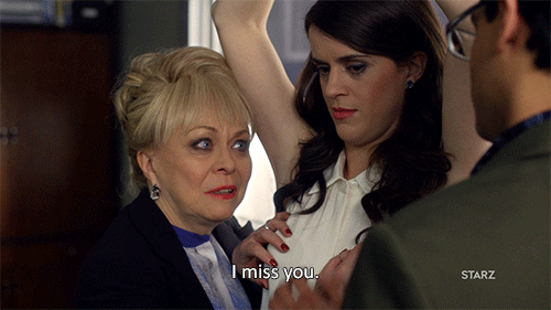 TV gif. Jacki Weaver as Rosalie in Blunt Talk, gazing intently at someone offscreen, says, "I miss you," ignoring Mary Holland as Shelly as she mindlessly touches her breast.