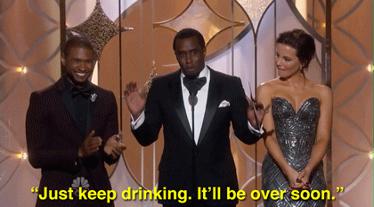Celebrity gif. Chris Rock speaks into the microphone, "Just keep drinking. It'll be over soon."