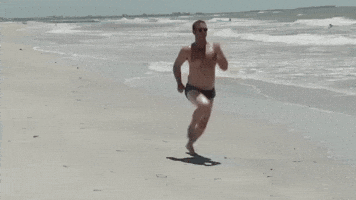 Reality TV gif. Lyle Boudreaux from Party Down South runs theatrically on a beach, skipping his legs and pumping his arms in an exaggerated way.