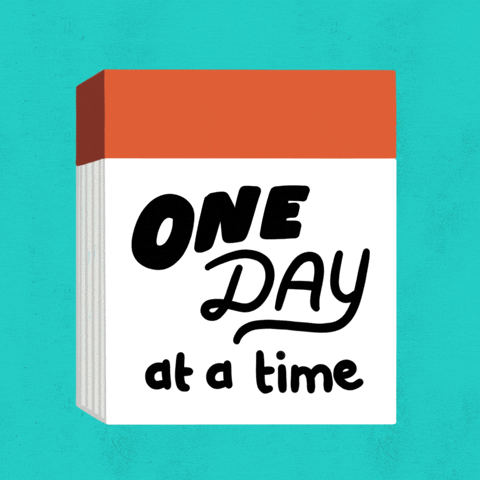 Digital art gif. An orange calendar page with the words "One day at a time" on it gets ripped off to reveal the same note the next day.