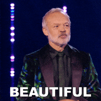 TV gif. Graham Norton on Queen of the Universe looks around, shaking his head in disbelief as he looks out at the judges and earnestly says, “Beautiful.”