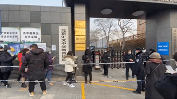 Lengthy Lines For Coronavirus Testing Form in Beijing's Dongcheng District