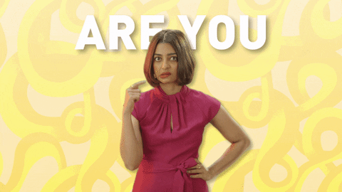 Celebrity gif. Radhika Apte has a hand on her waist and she is wide eyed as she twirls one hand around her temple in the crazy symbol. Text, "Are you mad!"