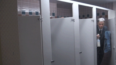 Video gif. Four men dressed in suits giddily emerge out of their bathroom stalls holding cleaning supplies. Text reads, "Work-work-work-work-work-wo-work."