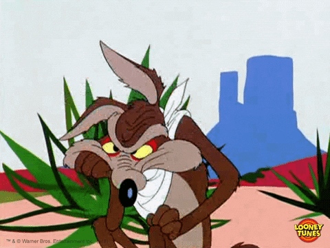 Cartoon gif. Wile E Coyote from Looney Tunes is bored and is sitting in the desert with his face in his paw. The other paw is impatiently tapping on his knee.