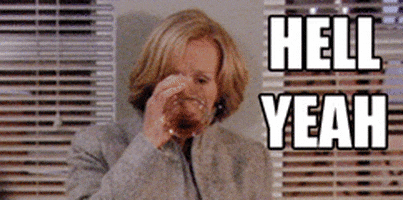 TV gif. Glenn Close as Patty Hewes in Damages leans against a wall sipping on a glass of alcohol. She then lifts the cup up like she’s cheering and gives a sarcastic look. Text, “Hell yeah.”
