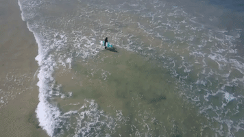 Pregnant Woman Surfs in Beautiful Video