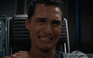 Movie gif. Matthew McConaughey as Cooper in Interstellar grits his teeth as he fights back tears, but he can’t stop his sobbing. He covers his mouth in anguish.
