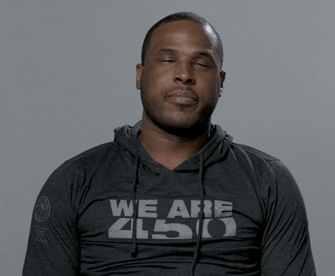 Video gif. Dion Waiters of the Miami Heat rolls his eyes and slumps back in his looking annoyed during an interview.