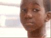 Video gif. A sad boy looks down as a single tear rolls down his face. He turns away.