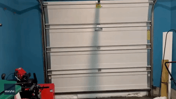 Man Opens Garage Door in New York to Reveal Wall of Snow