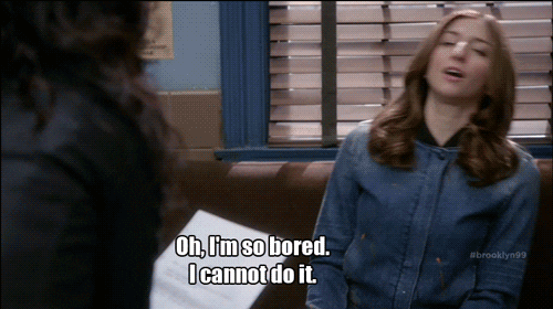 TV gif. Chelsea Peretti as Gina Linetti on Brooklyn Nine Nine sits on a couch and then flops sideways on it like she’s dead. She says, “Oh, I’m so bored. I cannot do it.”