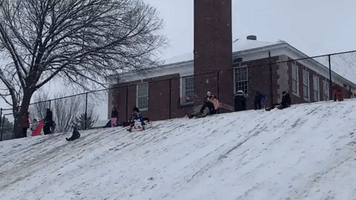 Kids Go Sledding as Winter Storm Blankets DC Area