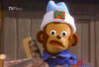 TV gif. A wide-eyed monkey puppet twists their mouth in shocked confusion as we zoom into his expression.