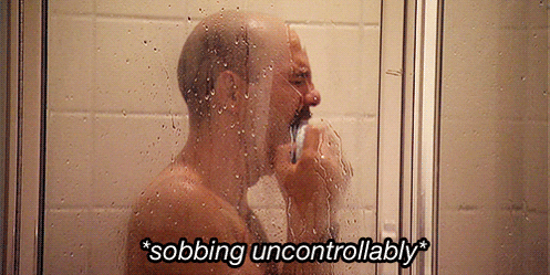 Arrested Development gif. David Cross as Tobias stands in the shower, sobbing and holding a washcloth up to his mouth. Text, "*sobbing uncontrollably*."