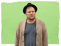 Celebrity gif. Patrick Stump looks at us and cringes like he just saw something disgusting.