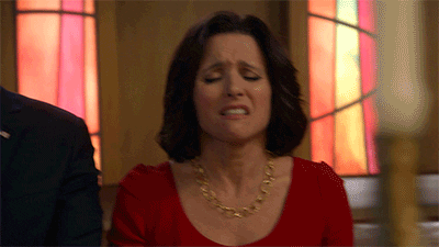 TV gif. Julia Louis-Dreyfus, as Selina in Veep, looks pained while an unimpressed Tony Hale, as Gary, shifts his eyes to the side and looks down his nose in suspicion.