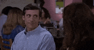 Movie gif. Steve Carell as andy Stitzer in The 40 year old Virgin sits in restaurant next to a woman. He has a sarcastic look on his face as he says, “Thank you.” to the woman. He turns away and his face relaxes to normal.  