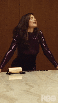 TV gif. Minka Kelly as Samantha in Euphoria propping herself up against a counter, wearing a sparkly purple dress, says "It's nice to be drunk."