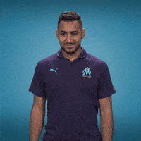 Sports gif. Dimitri Payet of Ligue 1 club Marseille looks at us and smiles before giving us the OK hand symbol. Emojis of the OK symbol pop up all around him and the text at the bottom also reads, "OK!"