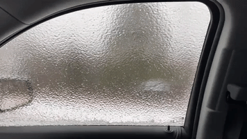 Sheet of Ice Freezes Over Car Window in Northern Ontario as Snow Squalls Predicted