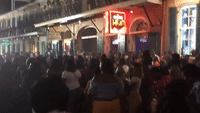 New Orleans Festivalgoers Do the Electric Slide on Bourbon Street