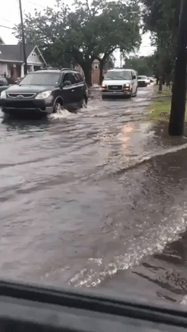 Vehicles Crawl Through New Orleans as Flash Flooding Hits