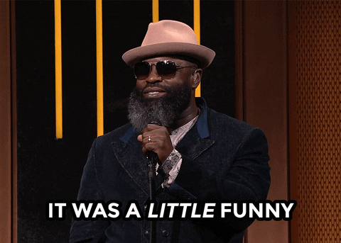 Celebrity gif. Wearing a fedora and sunglasses on The Tonight Show, a smiling Tariq Trotter stands at a microphone and says, “It was a little funny.”